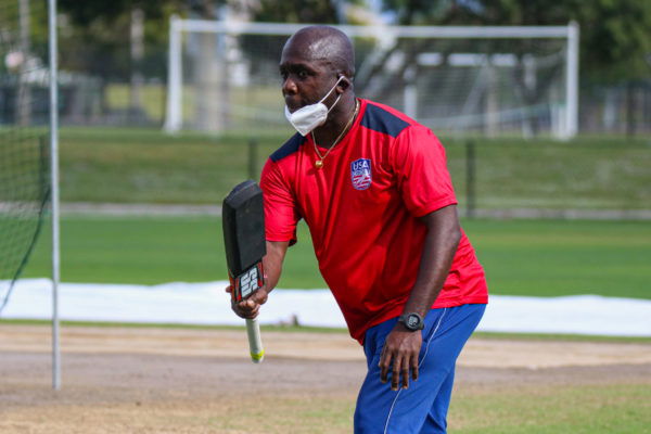 20211220 USA assistant coach Kevin Darlington hits a ball during training