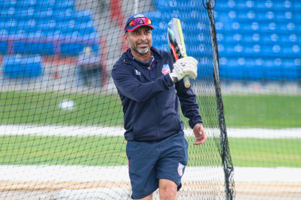 20211220 USA head coach J Arunkumar hits a ball during catching practice