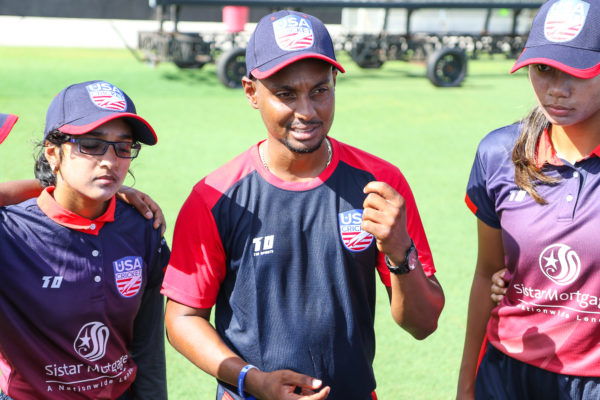 West U19 coach Mario Rampersaud gives some final instructions during team huddle